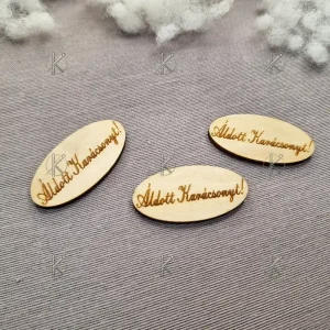 Ovális, fa natúr tábla "Áldott Karácsonyt" felirattal, 4x2 cm